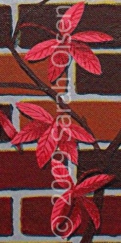 vine with red leaves clinging to a red brick wall