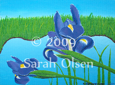 purple irises with a backround of a blue lake surrounded by high green grasses and blue sky
